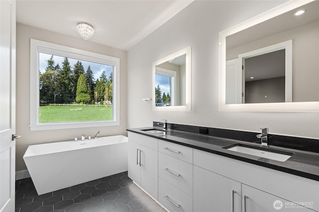 14449 133rd Pl NE, Woodinville, WA 98072 - full bathroom featuring double vanity, a soaking tub, tile patterned flooring, and recessed lighting