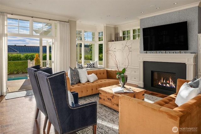 2665 Evergreen Point Rd NE, Medina, WA 98039 - living room featuring crown molding, a glass covered fireplace, and wood finished floors