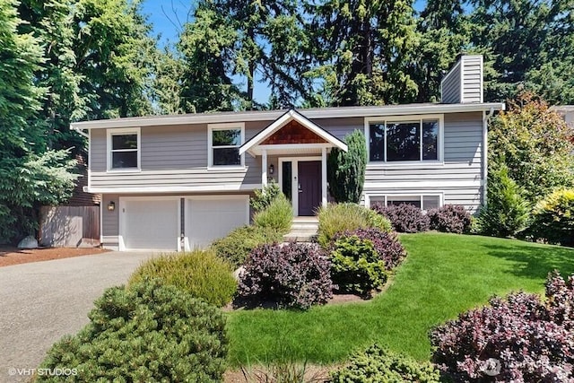 33700 33rd Pl SW, Federal Way, WA 98023 - raised ranch featuring a chimney, a garage, and asphalt driveway