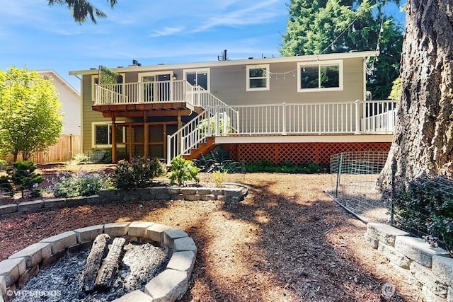33700 33rd Pl SW, Federal Way, WA 98023 - back of property featuring a wooden deck, stairs, and a fire pit