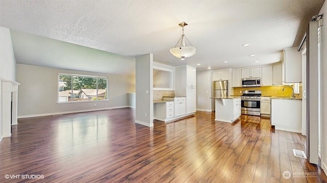 33700 33rd Pl SW, Federal Way, WA 98023 - unfurnished living room with dark wood-style flooring and recessed lighting