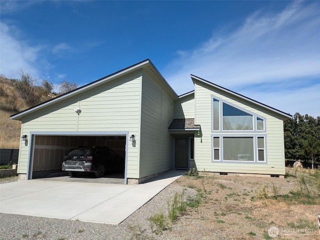 957 Twisp Carlton Rd Unit D, Twisp, WA 98856 - view of front of property with driveway, an attached garage, and crawl space