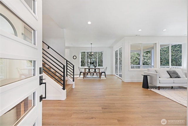 16806 62nd St SE, Snohomish, WA 98290 - foyer entrance featuring light wood-style flooring, stairs, recessed lighting, and a chandelier