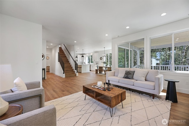16806 62nd St SE, Snohomish, WA 98290 - living room with light wood-style flooring, stairs, and recessed lighting