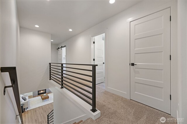 16806 62nd St SE, Snohomish, WA 98290 - corridor with recessed lighting, an upstairs landing, light carpet, and a barn door