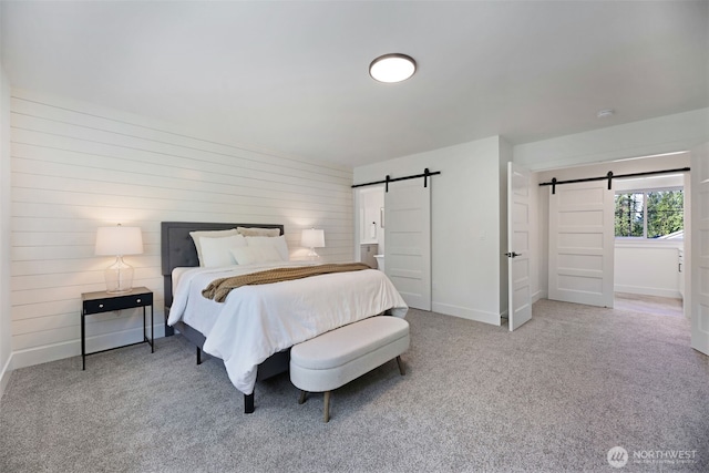 16806 62nd St SE, Snohomish, WA 98290 - carpeted bedroom featuring a barn door and wood walls
