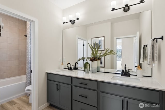 4163 Aberdeen Way NE, Renton, WA 98056 - full bathroom featuring double vanity, shower / tub combo, and wood finished floors