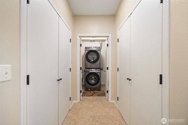 516 Darby Dr Unit 207, Bellingham, WA 98226 - washroom with stacked washer and clothes dryer and light tile patterned flooring