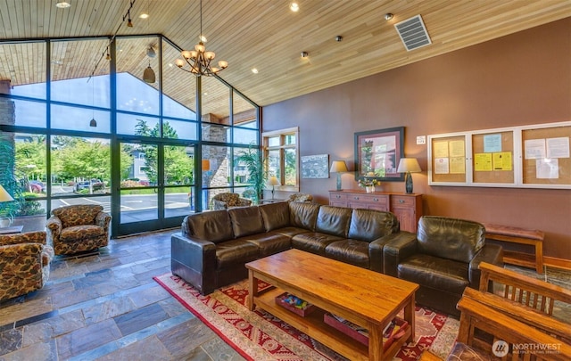 516 Darby Dr Unit 207, Bellingham, WA 98226 - living room featuring high vaulted ceiling, wooden ceiling, stone tile floors, a chandelier, and recessed lighting