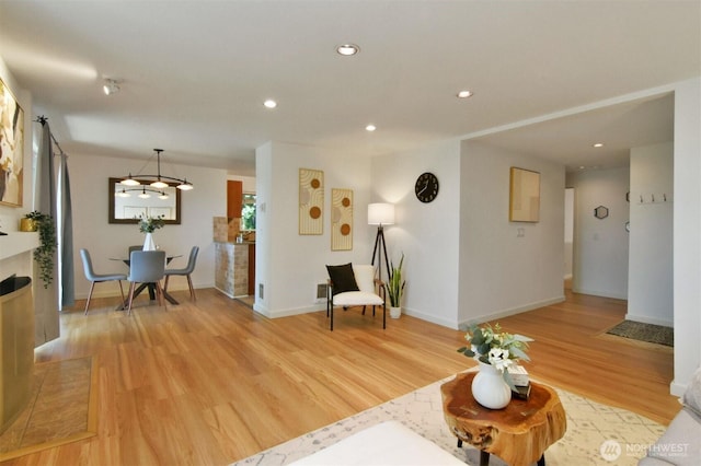 13021 SE 38th St Unit J8, Bellevue, WA 98006 - living area with light wood-style floors, recessed lighting, and a chandelier