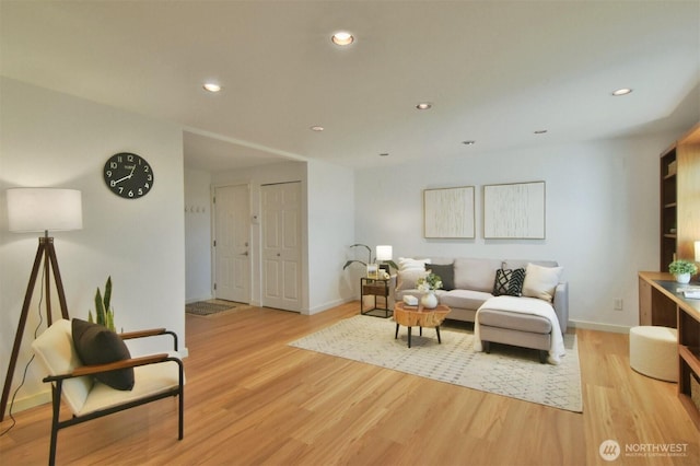 13021 SE 38th St Unit J8, Bellevue, WA 98006 - living room featuring light wood-style floors and recessed lighting