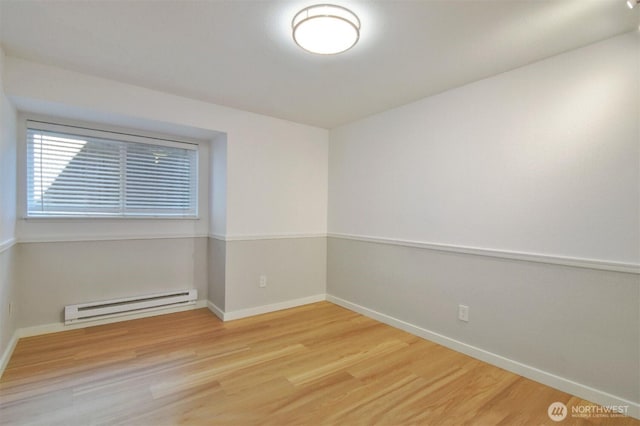 13021 SE 38th St Unit J8, Bellevue, WA 98006 - unfurnished room featuring baseboard heating and wood finished floors