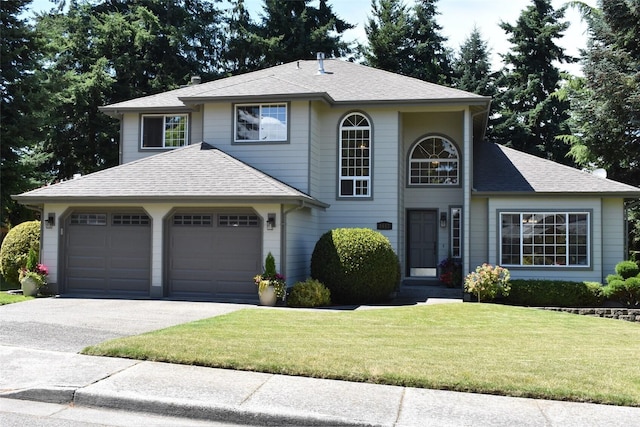 1017 Kelley Ridge Ct, Bellingham, WA 98229 - view of front facade featuring driveway, a front lawn, an attached garage, and a shingled roof