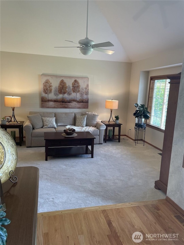 1017 Kelley Ridge Ct, Bellingham, WA 98229 - carpeted living area featuring ceiling fan, vaulted ceiling, and wood finished floors