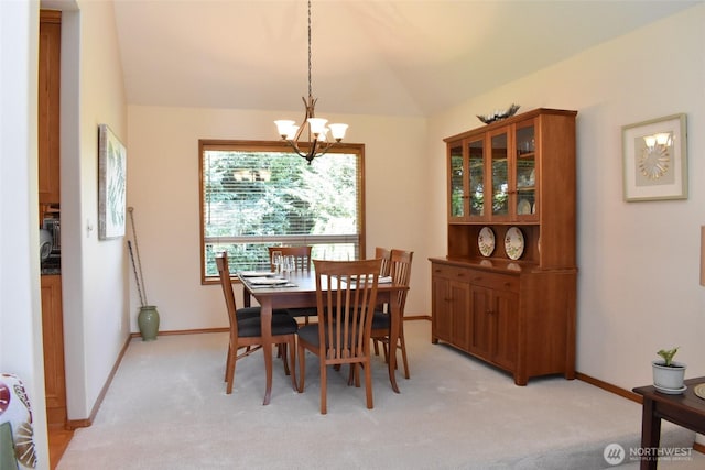 1017 Kelley Ridge Ct, Bellingham, WA 98229 - dining space featuring a chandelier, vaulted ceiling, and light carpet