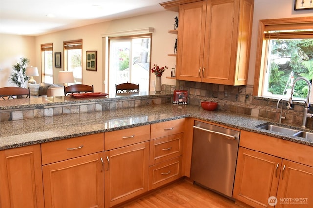 1017 Kelley Ridge Ct, Bellingham, WA 98229 - kitchen featuring stainless steel dishwasher, dark stone countertops, light wood-style floors, and backsplash