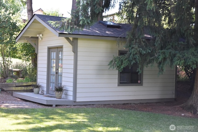 1017 Kelley Ridge Ct, Bellingham, WA 98229 - view of side of property featuring roof with shingles, a yard, and an outdoor structure