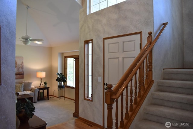 1017 Kelley Ridge Ct, Bellingham, WA 98229 - foyer entrance with stairway, a ceiling fan, and high vaulted ceiling