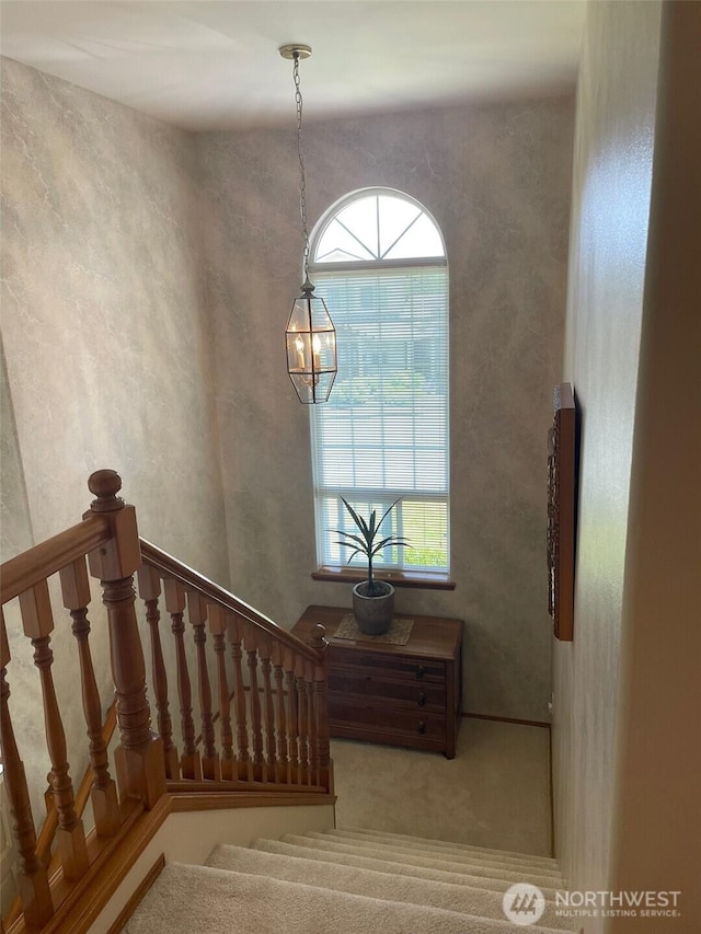 1017 Kelley Ridge Ct, Bellingham, WA 98229 - stairway with a chandelier and carpet flooring