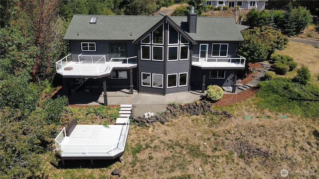1936 Summit Lake Shore Rd NW, Olympia, WA 98502 - rear view of property featuring a deck, a chimney, a patio, and stairs