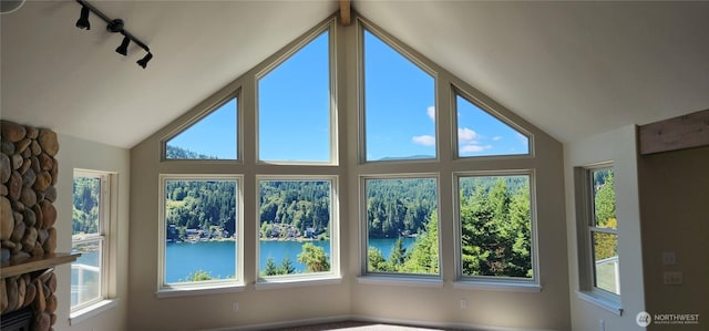 1936 Summit Lake Shore Rd NW, Olympia, WA 98502 - unfurnished sunroom with a water view, lofted ceiling, plenty of natural light, and rail lighting