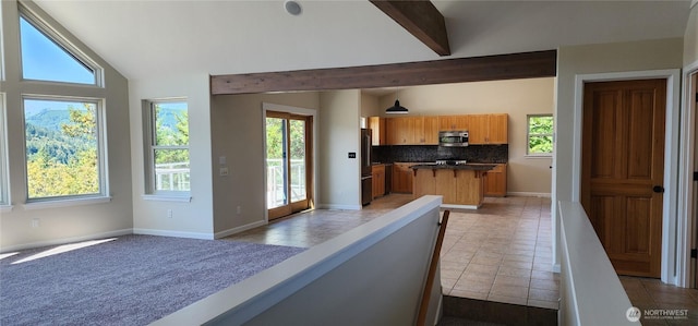 1936 Summit Lake Shore Rd NW, Olympia, WA 98502 - kitchen with stainless steel microwave, healthy amount of natural light, and backsplash