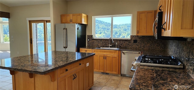 1936 Summit Lake Shore Rd NW, Olympia, WA 98502 - kitchen with stainless steel appliances, tasteful backsplash, healthy amount of natural light, and light tile patterned floors