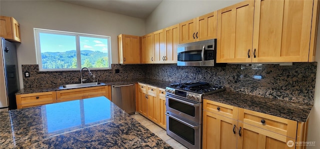1936 Summit Lake Shore Rd NW, Olympia, WA 98502 - kitchen with stainless steel appliances, backsplash, and dark stone counters