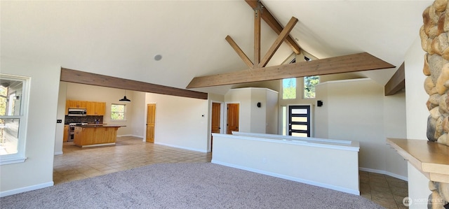 1936 Summit Lake Shore Rd NW, Olympia, WA 98502 - unfurnished living room with high vaulted ceiling, light tile patterned flooring, beamed ceiling, and light carpet