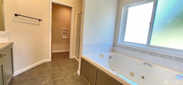 1936 Summit Lake Shore Rd NW, Olympia, WA 98502 - bathroom featuring plenty of natural light, vanity, a whirlpool tub, and tile patterned flooring