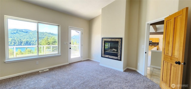 1936 Summit Lake Shore Rd NW, Olympia, WA 98502 - unfurnished living room with light colored carpet and a glass covered fireplace