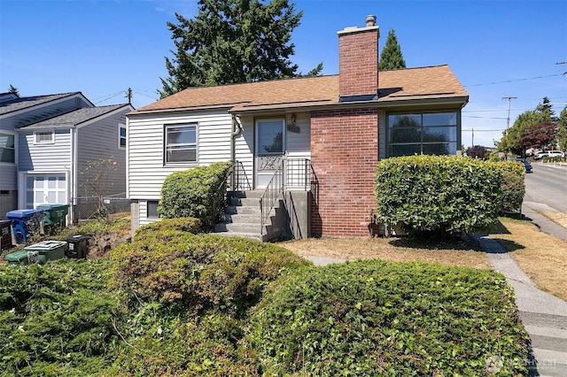 8403 36th Ave SW, Seattle, WA 98126 - view of front of house featuring a chimney and brick siding