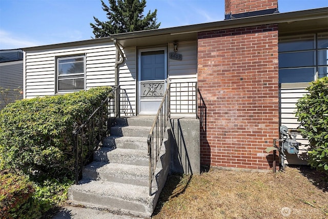 8403 36th Ave SW, Seattle, WA 98126 - property entrance with a chimney and brick siding