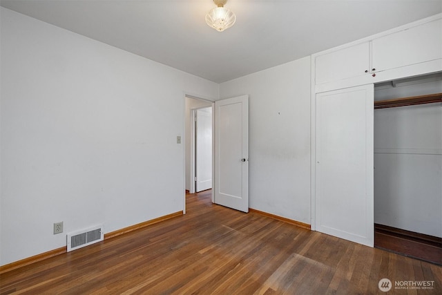 8403 36th Ave SW, Seattle, WA 98126 - unfurnished bedroom with wood finished floors and a closet