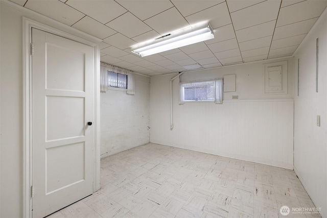 8403 36th Ave SW, Seattle, WA 98126 - below grade area featuring light floors and a wainscoted wall