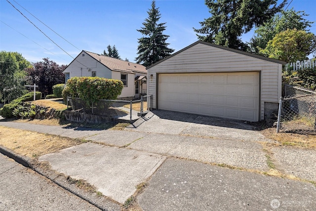 8403 36th Ave SW, Seattle, WA 98126 - view of front of house with a detached garage and an outbuilding