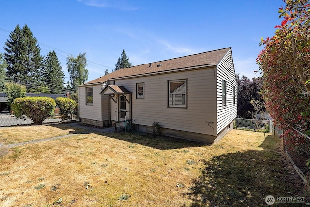 8403 36th Ave SW, Seattle, WA 98126 - view of front facade with a fenced backyard and roof with shingles