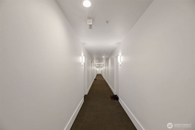 321 10th Ave S Unit 618, Seattle, WA 98104 - hallway featuring baseboards and dark carpet