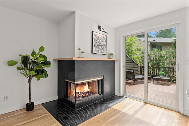 9641 NE 121st Ln, Kirkland, WA 98034 - detailed view of wood finished floors and a multi sided fireplace