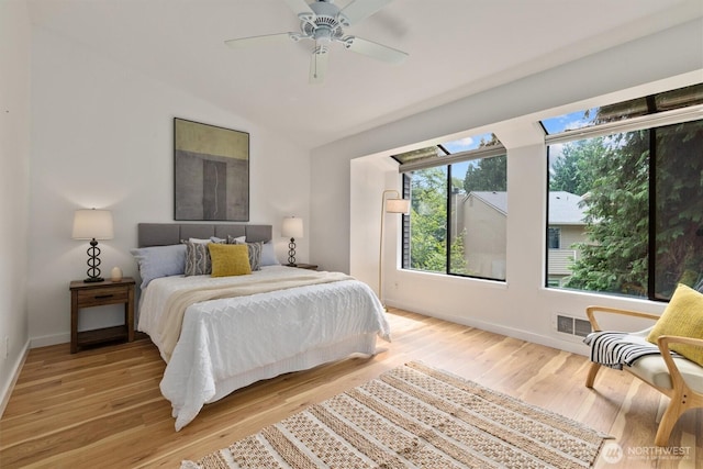 9641 NE 121st Ln, Kirkland, WA 98034 - bedroom with lofted ceiling, light wood-type flooring, and ceiling fan