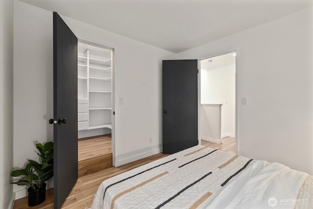 9641 NE 121st Ln, Kirkland, WA 98034 - bedroom featuring a spacious closet and light wood-style floors
