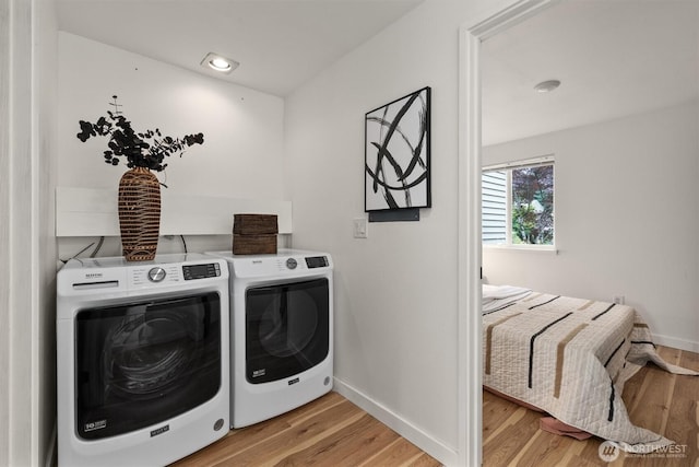 9641 NE 121st Ln, Kirkland, WA 98034 - laundry area with washer and clothes dryer, light wood-style flooring, and recessed lighting