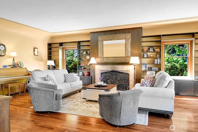 19453 Military Rd S, Seatac, WA 98188 - living area with wood finished floors, healthy amount of natural light, a fireplace, and ornamental molding