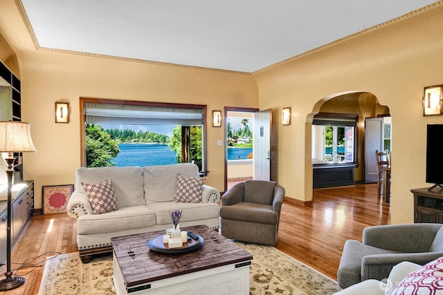 19453 Military Rd S, Seatac, WA 98188 - living area featuring arched walkways, wood finished floors, and crown molding