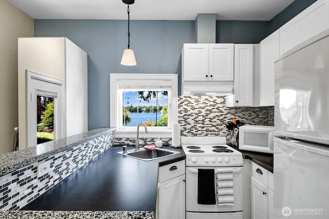 19453 Military Rd S, Seatac, WA 98188 - kitchen featuring white appliances, backsplash, white cabinetry, and healthy amount of natural light