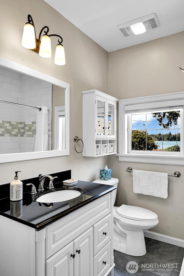 19453 Military Rd S, Seatac, WA 98188 - full bath featuring vanity, tiled shower, and tile patterned floors