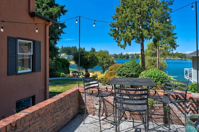 19453 Military Rd S, Seatac, WA 98188 - view of patio with a water view and outdoor dining area