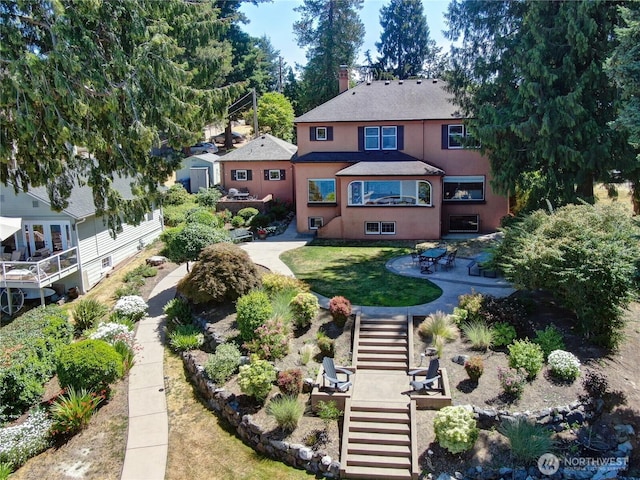 19453 Military Rd S, Seatac, WA 98188 - back of house with stairs, stucco siding, a shingled roof, and a patio