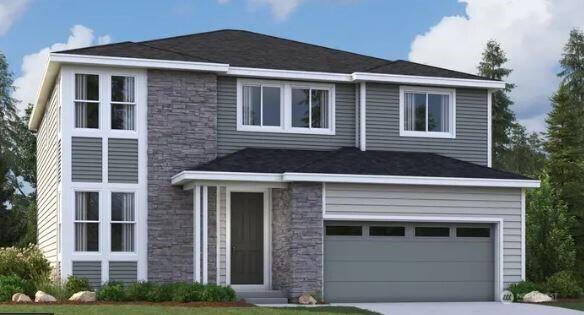 18019 139th Pl E Unit 19, Puyallup, WA 98374 - view of front facade featuring stone siding, driveway, and a garage