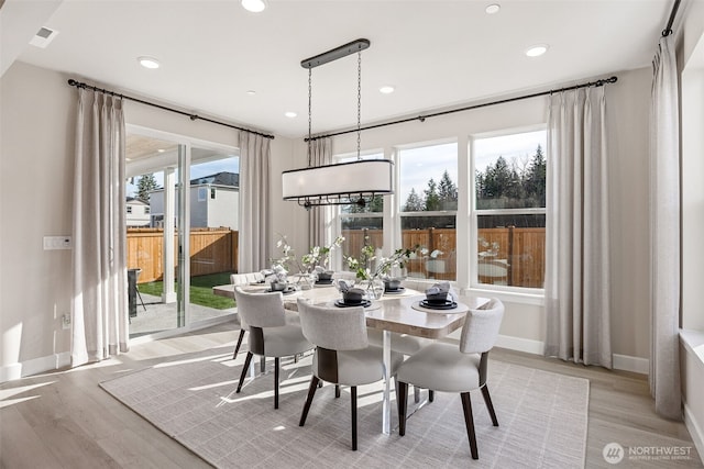 18019 139th Pl E Unit 19, Puyallup, WA 98374 - dining area featuring healthy amount of natural light, light wood finished floors, and recessed lighting